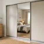 Sliding closet doors fully closed in a bedroom with a cozy, modern interior.