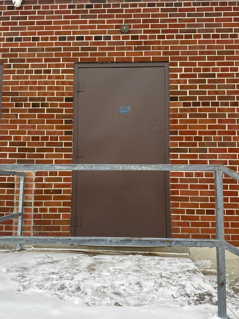 Fix metal door with brick wall